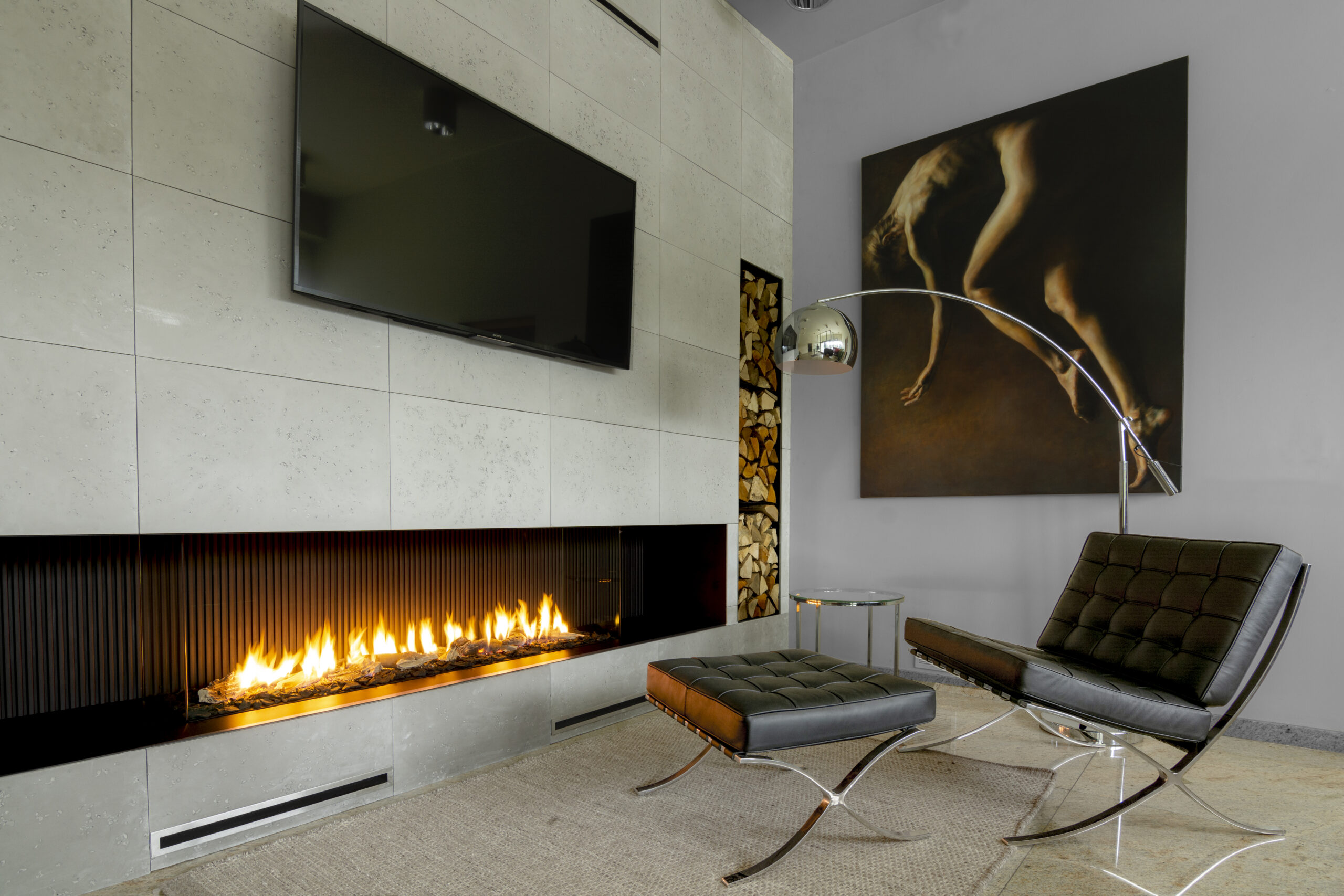 TV installed above an ethanol fireplace